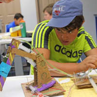 <p>A student works on a STEM project at the Maritime Aquarium as part of the Mayor’s Student Engineering &amp; Science Program.</p>