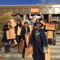 <p>On Saturday, November 14th 2015: A team of volunteers hold finished planter boxes that they built for a greenhouse in Harrison, where they will be used to grow fresh winter produce for those in need.</p>