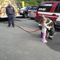 <p>Chapel Hill students got a chance to fire a hose during the visit from firefighters.</p>