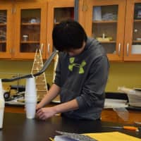 <p>Bronxville Middle School eighth-graders, who have been studying about potential and kinetic energy, build marble roller coasters in their science classes.</p>