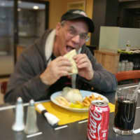 <p>A customer eats an empanada at Soto&#x27;s new restaurant.</p>