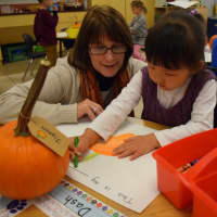 <p>A Bronxville Elementary School student draws a pumpkin as part of the lesson.</p>