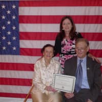 <p>Covenant Award recipient Virginia Hefti (sitting) holds the award while flanked by Eastchester town historian Richard Forliano and Annmarie Flannery at the Eastchester Historical Society&#x27;s annual dinner Sept. 18.</p>