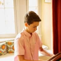 <p>Pianist Luca Gierlinger of New Rochelle, a middle school student, will perform at Carnegie Hall on May 17.</p>