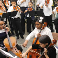 <p>A combined string ensemble from Lincoln and Pennington elementary schools performed at the book fair.</p>