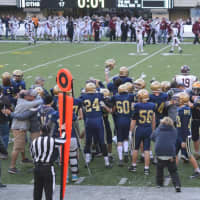 <p>The Old Tappan football team heads to midfield after winning the state title over Wayne Hills Saturday, Dec. 5.</p>