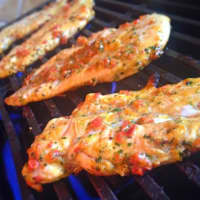 <p>Grilled chicken with roasted red pepper sauce.</p>
