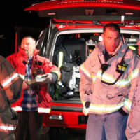 <p>Incident Command Center- (left to right) Battalion 6, Ted Pollack, Mahopac Asst. Chief Jay Kinash check in with MFVFD Chief Jeff Boyle as he listens to a neighbor.</p>