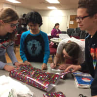 <p>Approximately 30 children participated in this annual tradition, and together they wrapped more than 50 presents.</p>