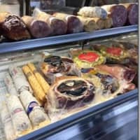 <p>Refrigerator cases are stocked with meats for the  opening of the new Siegel Bros. Marketplace in Mount Kisco.</p>