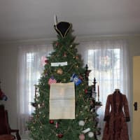 <p>A tree is decorated with objects by peddlers at the Sherman Historical Society.</p>