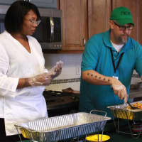<p>Dishing up the summer meals at the Martin Luther King Jr. Apartments in Stamford.</p>