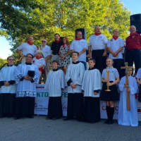 <p>A choir sang during the opening procession at the Feast of St. Gennaro in Yorktown.</p>
