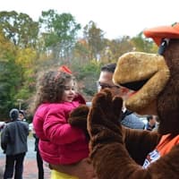 <p>The Briarcliff bear greets kids at the Ragamuffin Parade.</p>