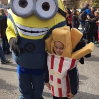 <p>A minion and a french fry make friends at the Ragamuffin Parade in Pleasantville.</p>