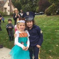 <p>A Shopkin poses with a junior police officer at the Briarcliff Ragamuffin Parade.</p>