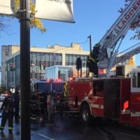 <p>Firefighters on the scene at 1912 Palmer Avenue following a blaze that left two dozen people displaced Saturday.</p>