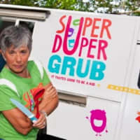 <p>Laura Bonilla strikes a pose outside her Super Duper Grub food truck.</p>