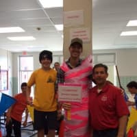 <p>BFMS sixth-grader Michael Amoruso, left, Dan Cermack and Guidance Counselor and Student Council Co-Advisor Dave Tashian raise money for breast cancer in Ridgewood.</p>