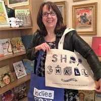 <p>Francine Lucidon, owner of The Voracious Reader in Larchmont, N.Y. The store plans fun events and giveaways like this bag on &quot;Indie Book Store Saturday&quot; Nov. 26.</p>