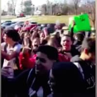 <p>Danbury High students stage a walkout protest Thursday over a harassment incident last month in the parking lot.</p>