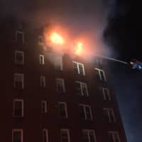 <p>Firefighters from New Rochelle are offering an assist to crews battling a four-alarm blaze at a Yonkers apartment building.</p>