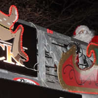 <p>Mario Izzo as Santa waving to the crowds on Christmas Eve.</p>