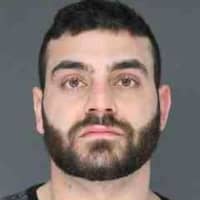<p>Kevork Manougian of Congers was charged with pointing a loaded AR-15 assault rifle at another man.</p>