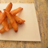 <p>Dave Popple&#x27;s French fries atop a board from the Royal Copenhagen collection.</p>