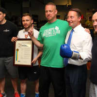 <p>Carl &quot;The Jackal&quot; Frampton with his team and trainers from Champs Boxing Club in New Rochelle.</p>