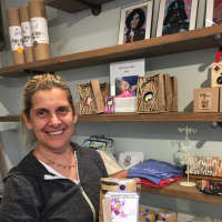 <p>Melanie Reichler, partner in the Little Beehive Store in the New Rochelle Metro-North station with an Organic Glrow Kit.</p>