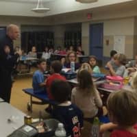 <p>Bronxville Police Sgt. William Carroll talks to elementary school students about safety on Halloween.</p>