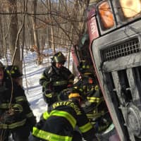 <p>Members from the Patterson Fire Department rescue two people who were trapped inside a handicapped van following a crash.</p>