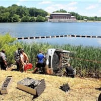 <p>Mulitple first responders work to save occupants in a car that crashed into the reservoir.</p>