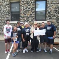<p>The Eastchester Irish American Social Club (EIASC) presents a ceremonial check for $15,000 to the Friends of the Eastchester Library from the proceeds of the Second Annual Eastchester 5K Race on Sept. 27. 2015.</p>
