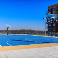 <p>The outdoor deck at &quot;The Modern&quot; has a basketball court.</p>