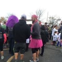 <p>Pink tutus and wigs are a favorite costume at the Vicki Soto 5K.</p>