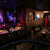 <p>The bar upstairs merges into the seating areas.</p>