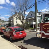 <p>Westport firefighters respond to a porch blaze Tuesday morning on Franklin Street.</p>