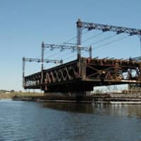<p>The Walk Bridge, which carries four train tracks for Metro-North and Amtrak, swings open to allow marine traffic to move through Norwalk Harbor.</p>