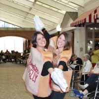 <p>Women show off their costumes. </p>