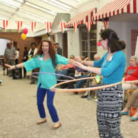 <p>Employees tried the hula hoop at the circus.</p>