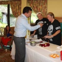 <p>Chef Terri Salmons of The Inn, Waveny’s independent living community speaking into the microphone.</p>