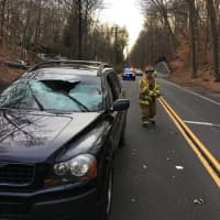 <p>The Weston Volunteer Fire Department responds after a tree branch slams through a car&#x27;s windshield.</p>