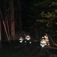 <p>A car hit a tree and caught fire on Old Redding Road in Weston Tuesday morning.</p>
