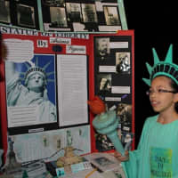 <p>A student presents on the Statue of Liberty.</p>