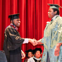 <p>A graduate receiving his diploma.</p>