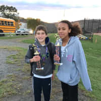 <p>Ryan Rupprecht, left, and Nicole Holmes, of Westport, won individual honors for Wilton Running Club at the recent Western Connecticut Conference Middle School cross country championships.</p>