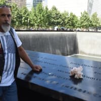 <p>Renegade Pigs North Jersey Chapter founder/past president Les Goldstein, a retired Clifton police officer, at the WTC Memorial.</p>