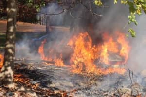 Firefighter Pulls Unconcious Person From Burning Car At Cemetery In Area